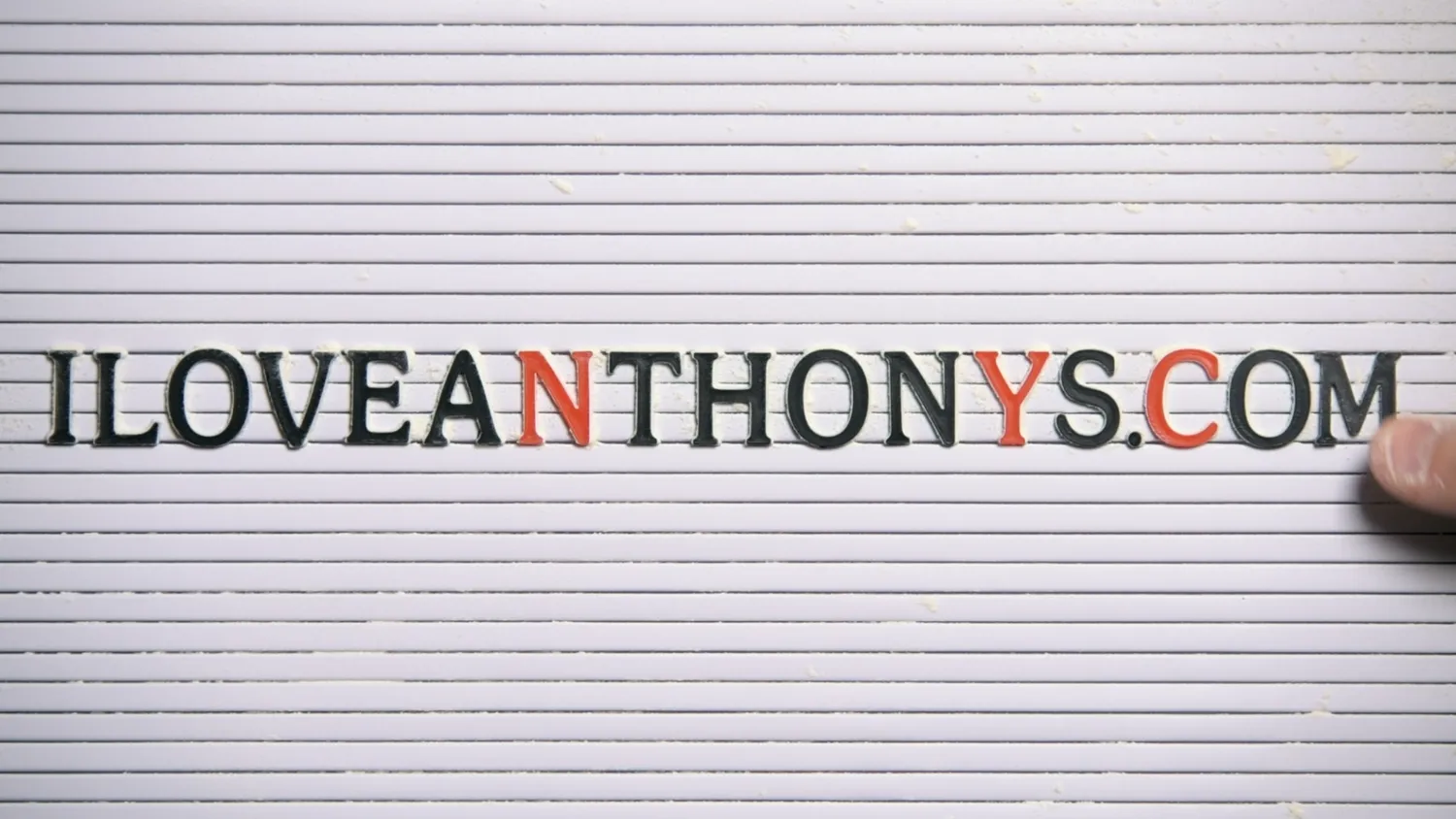 Anthony’s Pizza sign assembled from black and red letters