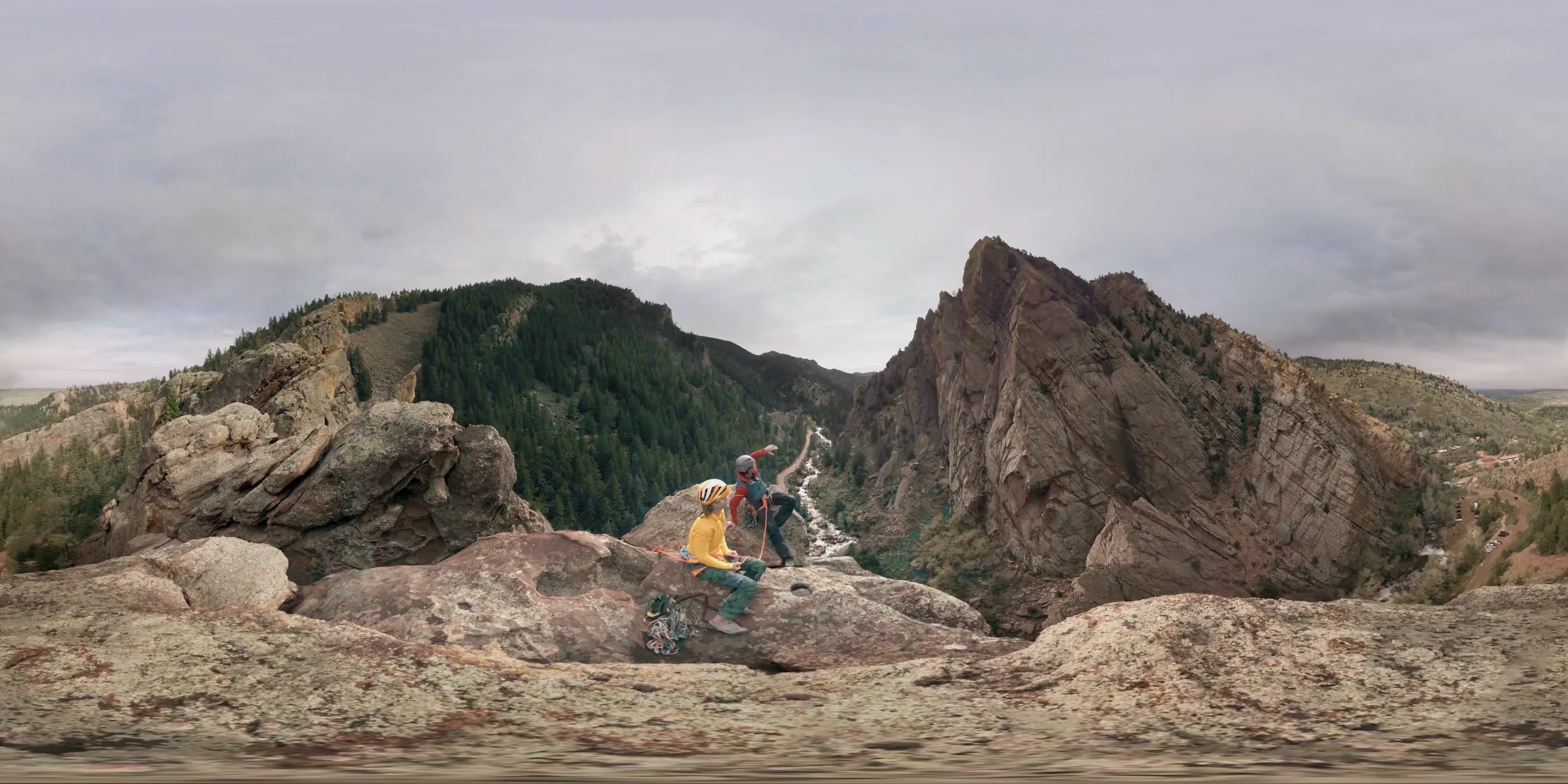 Climbers on a high Colorado rock face in a 360-degree frame