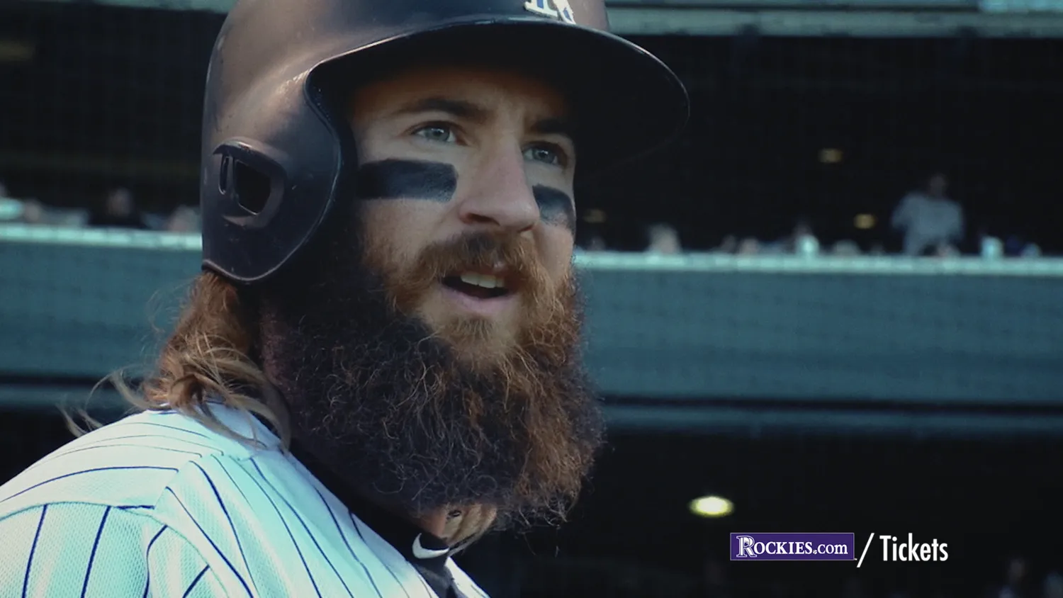Charlie Blackmon at bat with a Rockies.com tickets graphic